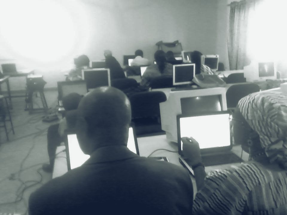 Adults learning on laptops in a computer lab